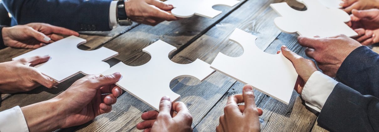 Business people and puzzle